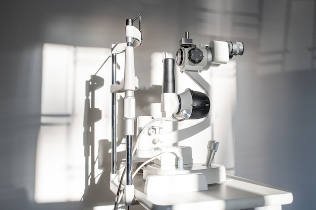 Ophthalmological diagnostic equipment on workplace of clinician inside medical office of contemporary ophthalmic clinics or hospital