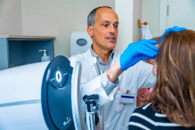 Ophthalmologist and mature woman during treatment for glaucoma