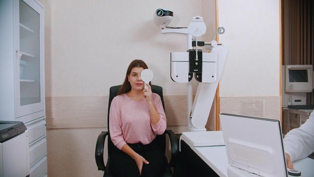 Ophthalmology treatment young woman checking her vision