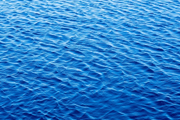 Oppervlakte van water, blauwe golfachtergrond