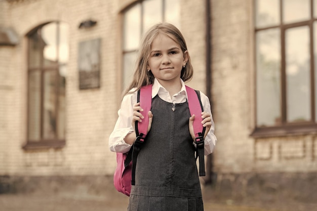 Photo opportunities for learning small kid go to school carrying bag back to school supplies fashion uniform formal dress code schoolwear knowledge day primary education september 1