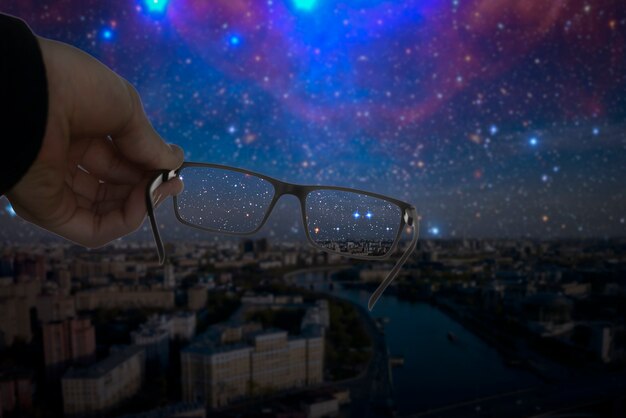 An optical eyevision concept, frame of eyeglasses show focused image on the blurred background