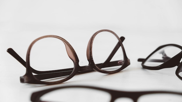 Optical glasses of different shapes on a white background