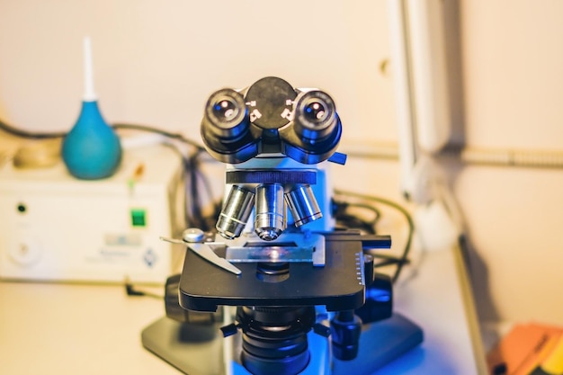 Optical microscope with four different objective lenses.