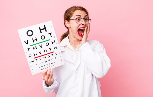 optical vision test doctor against pink wall