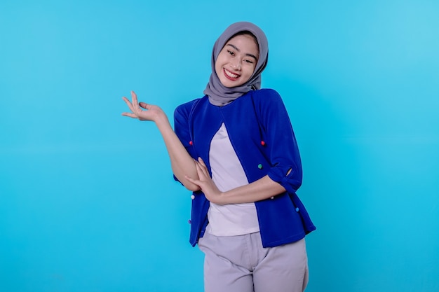 Optimistic charming attractive young woman with cute smiling joyfully with nice white smile on light blue background