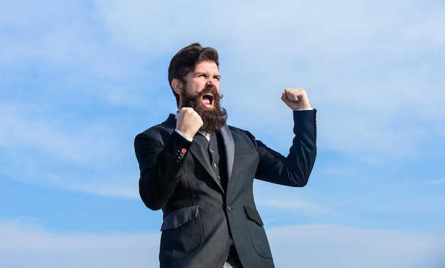 Photo optimistic mood success and luck being optimistic man bearded optimistic businessman wear formal suit sky background think like optimist celebrate success hopeful and confident about future