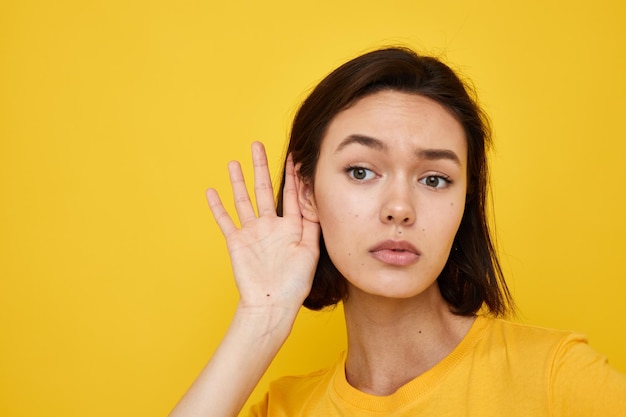 Optimistic young woman in a yellow tshirt Youth style casual Lifestyle unaltered