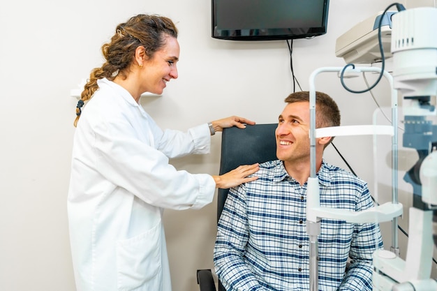 Optometrist comforting a patient during a check up