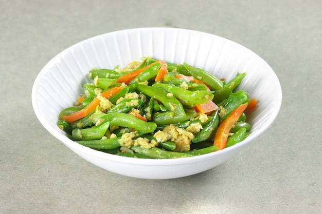 Orak Arik Buncis or Scrambled green beans or snap beans or string beans and carrot with omelette.