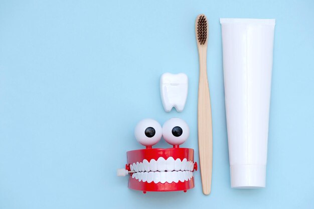 Oral care products on a light blue background. Oral hygiene.