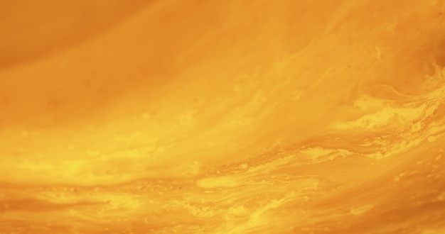 オレンジ色の抽象的な背景インクテクスチャペイントフロー砂漠の砂ぼかし金色の黄色の浮遊流体明るい装飾的な抽象的なバナー