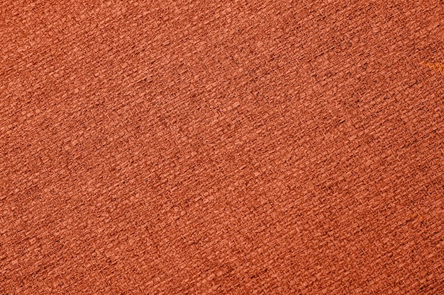 Orange background fabric texture macro closeup