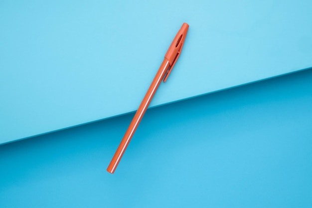 Orange Ballpoint on Blue background Blue board