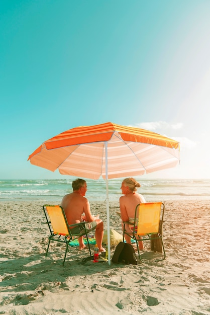 Orange beach umbrella collage