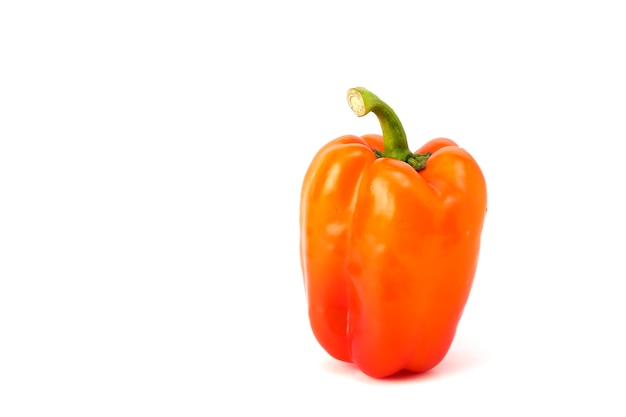 Orange bell pepper on white background