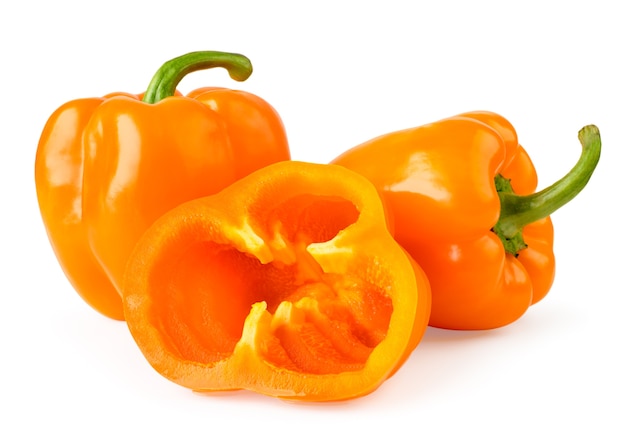 Orange bell peppers and half sliced rings close up isolated