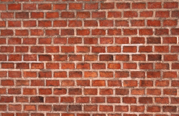 Orange brick wall made of brick and cement. Brick wall texture background