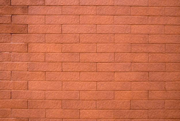 Orange brick wall texture background with space for text