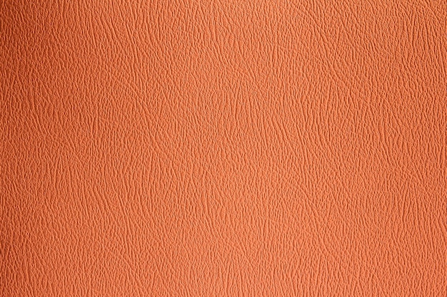 Оранжевый или коричневый фон текстуры кожаного листа