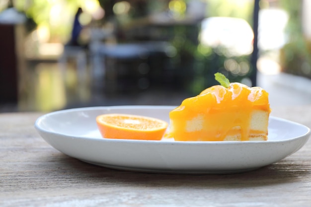 Orange cake on wood background