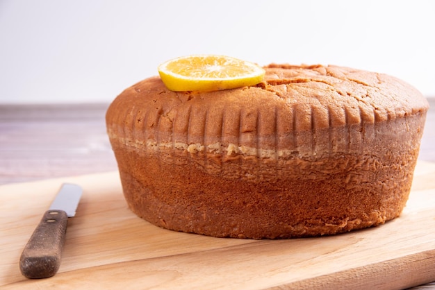 Orange cake over wooden surface selective focus