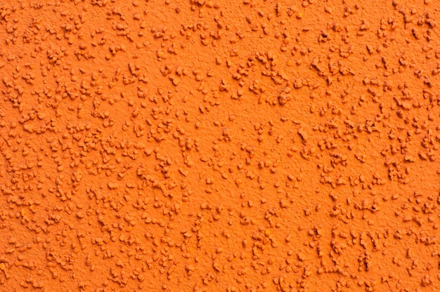 オレンジ色のセメントコンクリート抽象的なテクスチャ背景