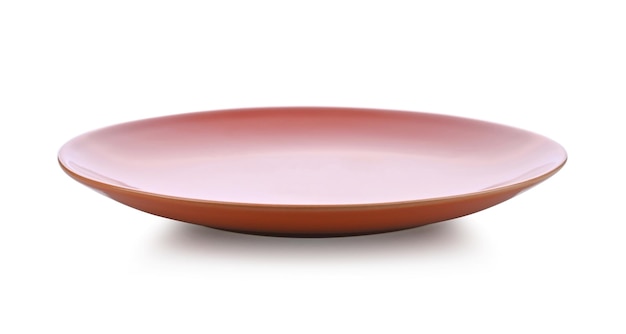 Orange ceramic plate on white floor