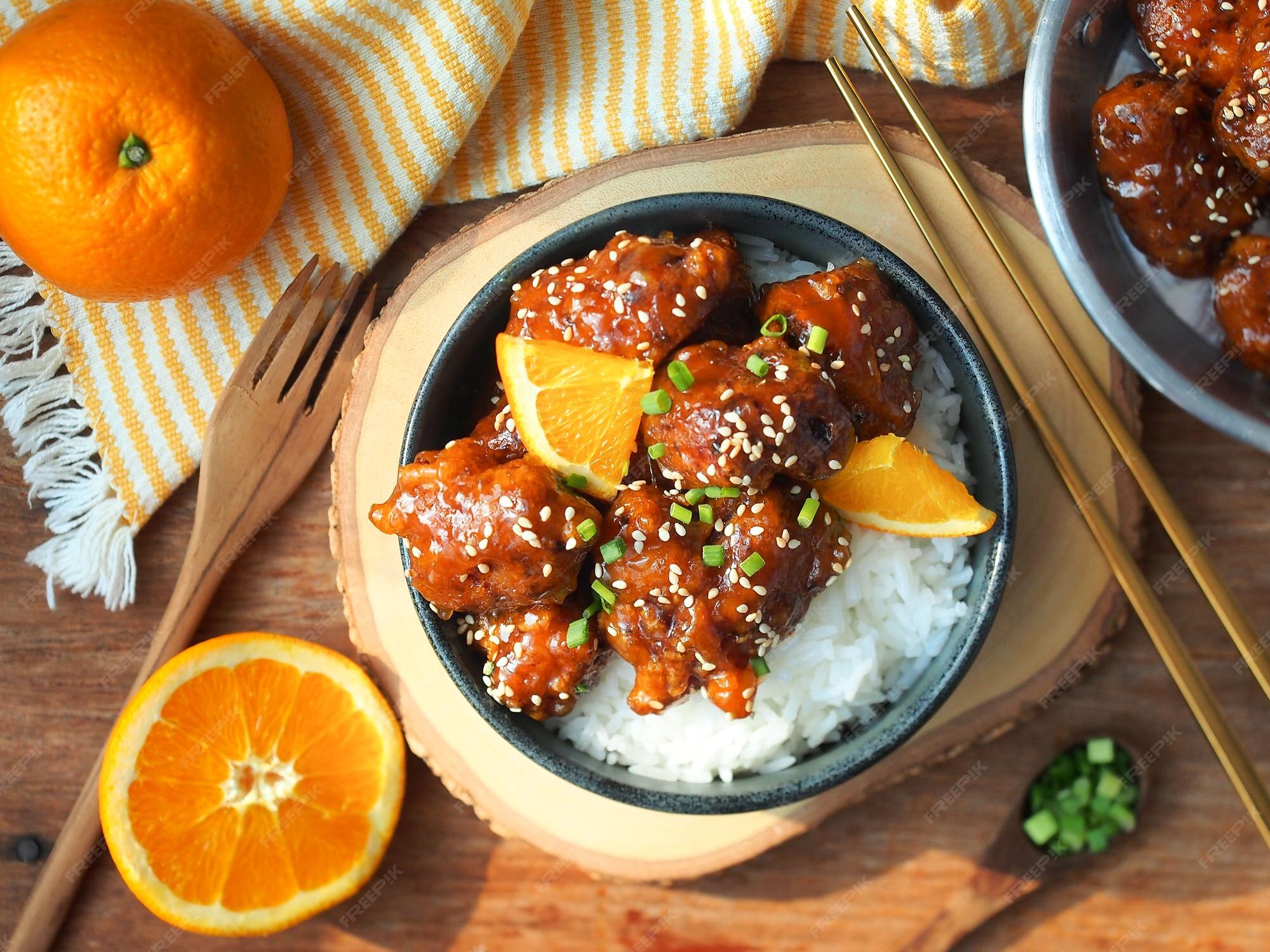 Premium Photo | Orange chicken Deep fried chicken breast with orange