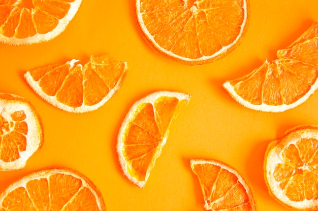 Orange chips on an orange background top view A healthy snack