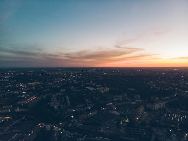 Orange clouds with blue sky on sunset copy space aerial view city on background