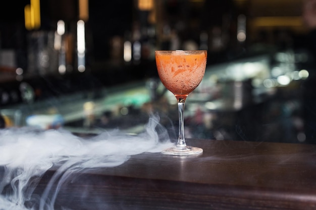 Orange cocktail with smoke
