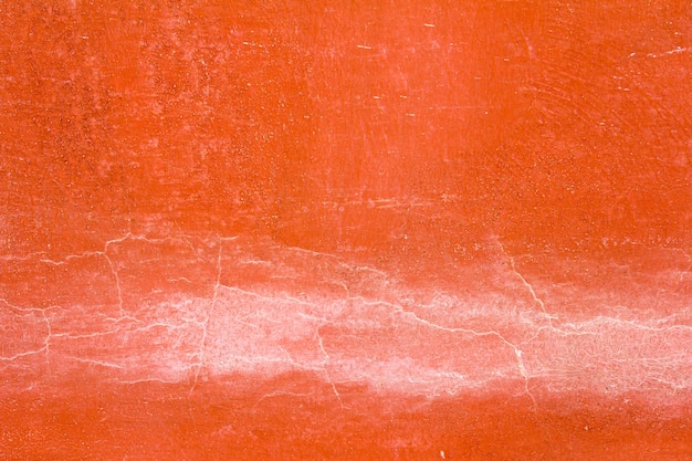 Orange color concrete wall with the crack background