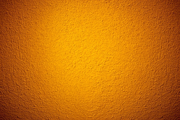 Orange color grunge cement wall texture background