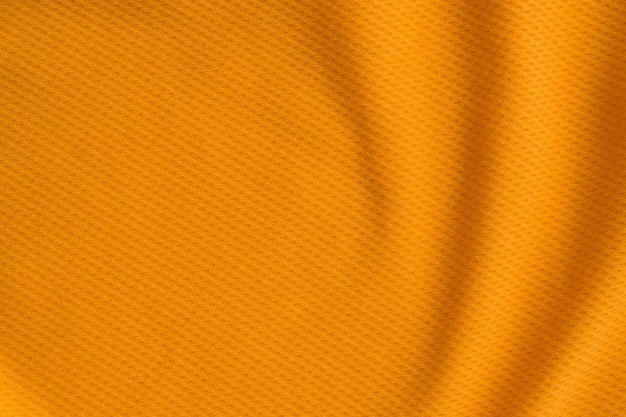 Colore arancione abbigliamento sportivo tessuto jersey maglia da calcio texture vista dall'alto