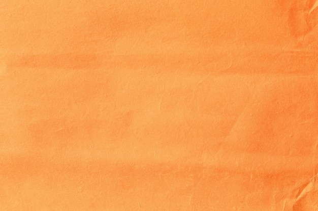 orange crumpled paper surface texture close up