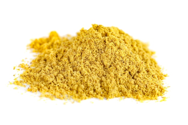 Photo orange curry spice isolated on the white, utskho suneli