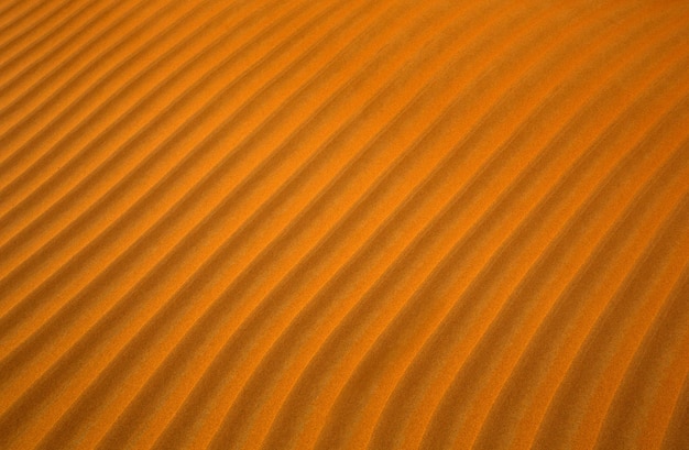 Orange desert sand pattern background with lines