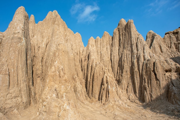 Orange earth sticks against the blue sky