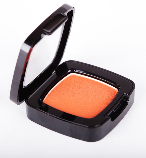 Photo orange eye shadows on white background