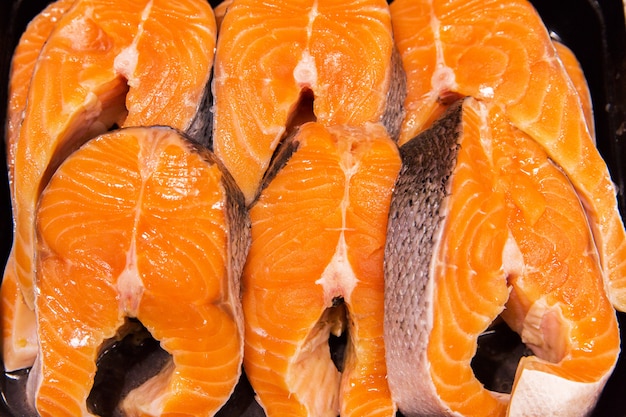 Orange fish in the market. Trout, salmon. Texture of fish