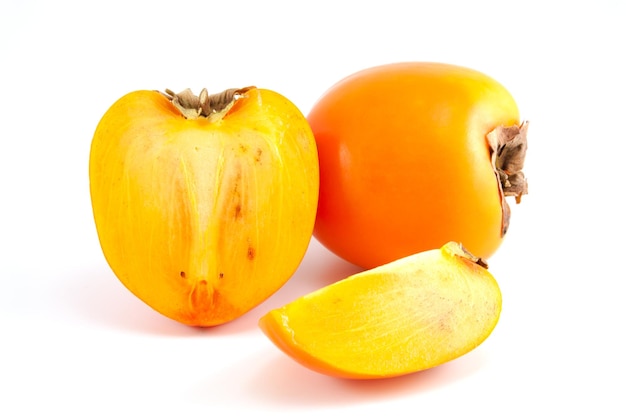 Orange fresh organic persimmon on white background