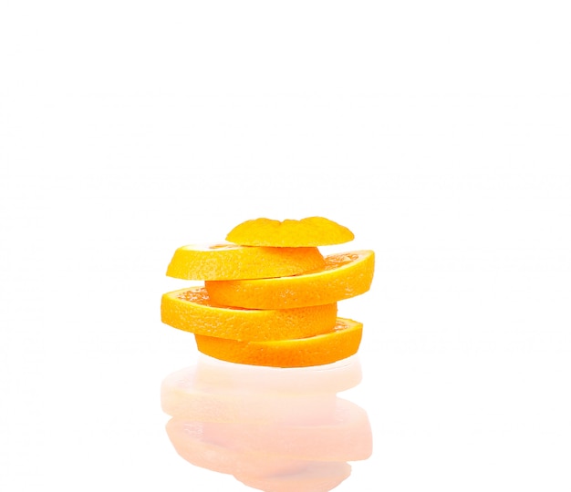 Orange fruit half and two segments or cantles isolated on white cutout