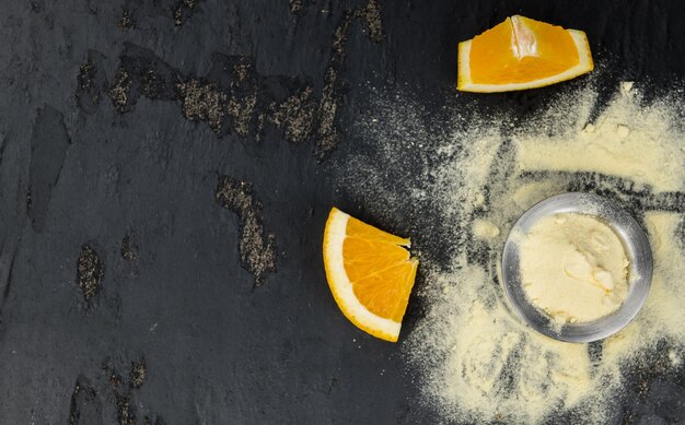 Orange fruit powder on a slate slab