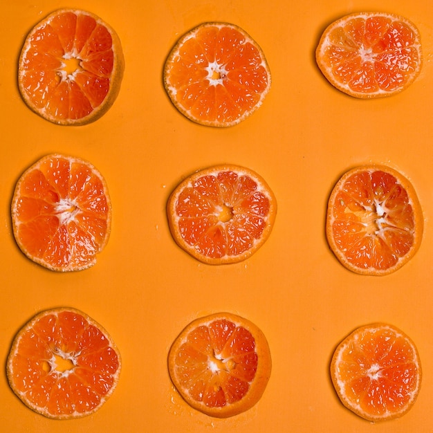 Orange fruit slice on orange background