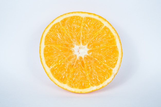 Orange fruit slice on white background