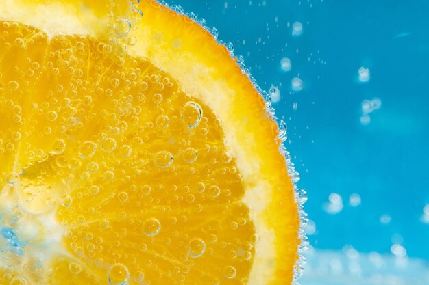 Orange fruit in the water closeup macro refreshing grapefruit drink cocktail