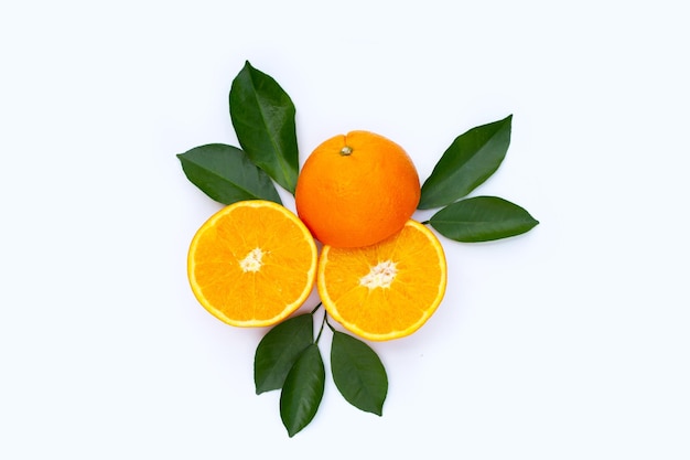 Orange fruit with green leaves on white background