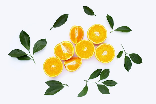 Orange fruit with green leaves on white background