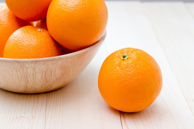 Orange fruit on wooden background